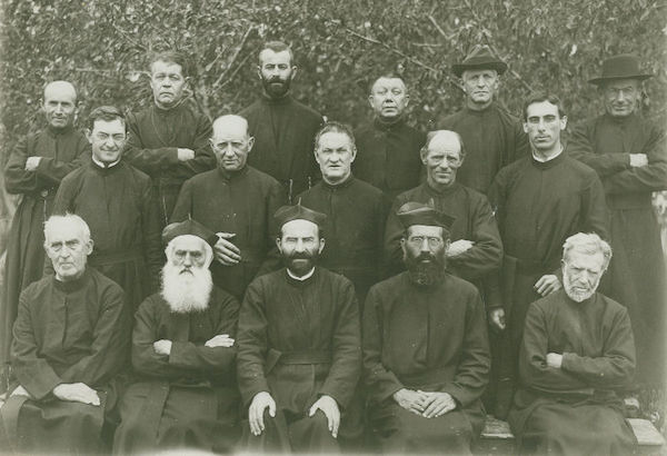 Jesuit Community of St. Francis Mission, 1917 From left, top row: Br. Bernard Hinderhofer, S.J.; Br, Theodor I. Sturm, S.J.; Br. Willibald Dreier, S.J.; Br. Anthony Axt, S.J.; Br. Wendelin J. Waible, S.J.; Br. Henry Rupp, S.J. From left, second row: Fr. Leo Cunningham, S.J.; Br. Adam Vollmayer, S.J.; Br. John Taggiasco, S.J.; Br. Andrew Hartmann, S.J.; Fr. Joseph Zimmerman, S.J. From left, front row: Br. Joseph Kohls, S.J.; Fr. Florentin Digmann, S.J.; Fr. Eugene Buechel, S.J.; Fr. Henry Grothe, S.J.; Br. Mueller. S.J. Source: The Blackrobe in the Land of the Wigwam, St. Francis Mission, St. Francis, S.D., 1921.